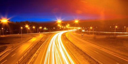 A brightly lit highway. 